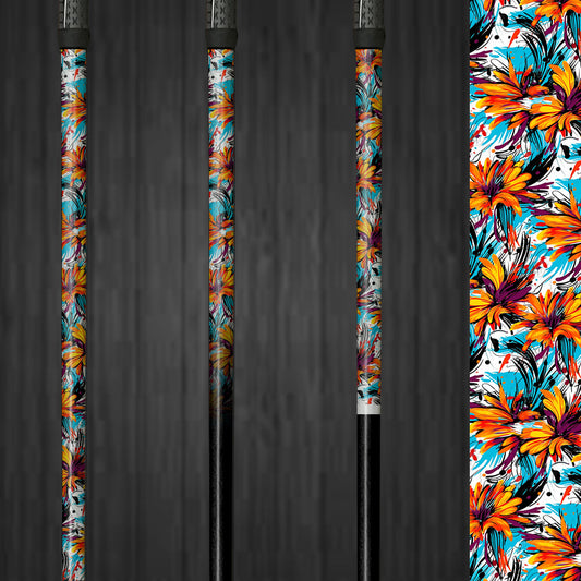 A golf club with a vinyl shaft wrap featuring bright orange and blue flowers on a white background. The wrap is applied smoothly, adding a vibrant and custom look to the club. The colorful floral design highlights the easy application and the energetic style it brings to the golf shaft.